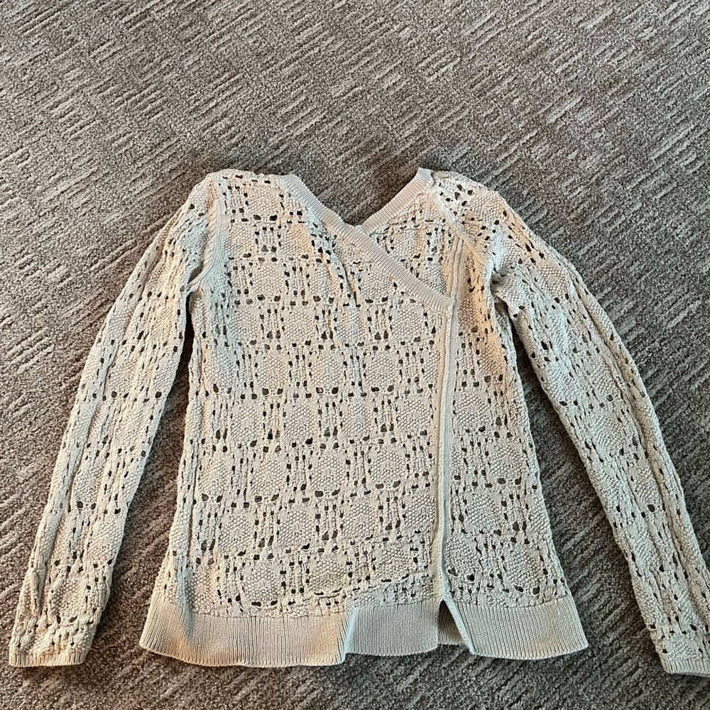 Soft crocheted pullover sweater.